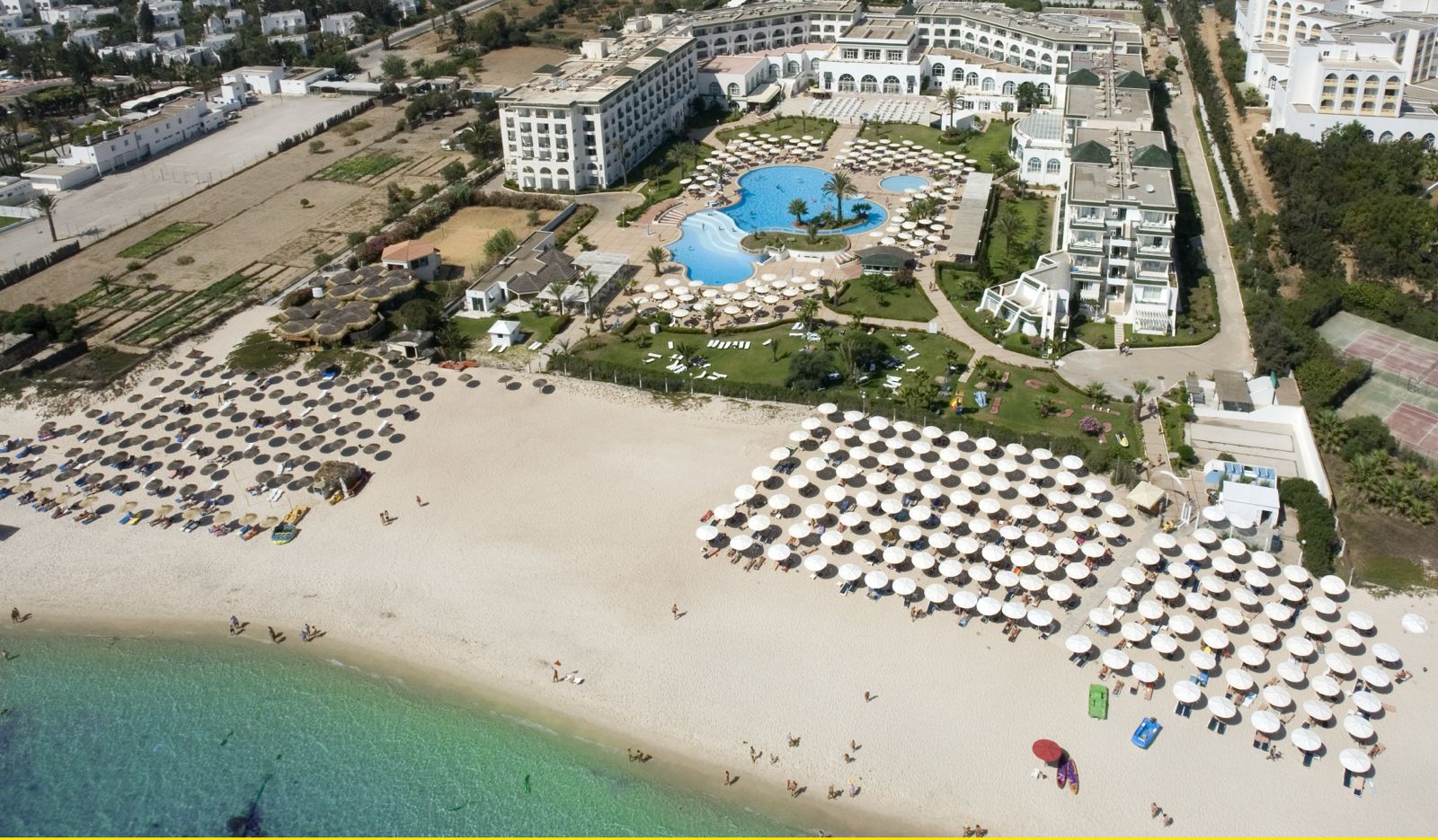 Aerial view of Tunisia beach resort with pool and sunbeds - JustSunShine Holidays
